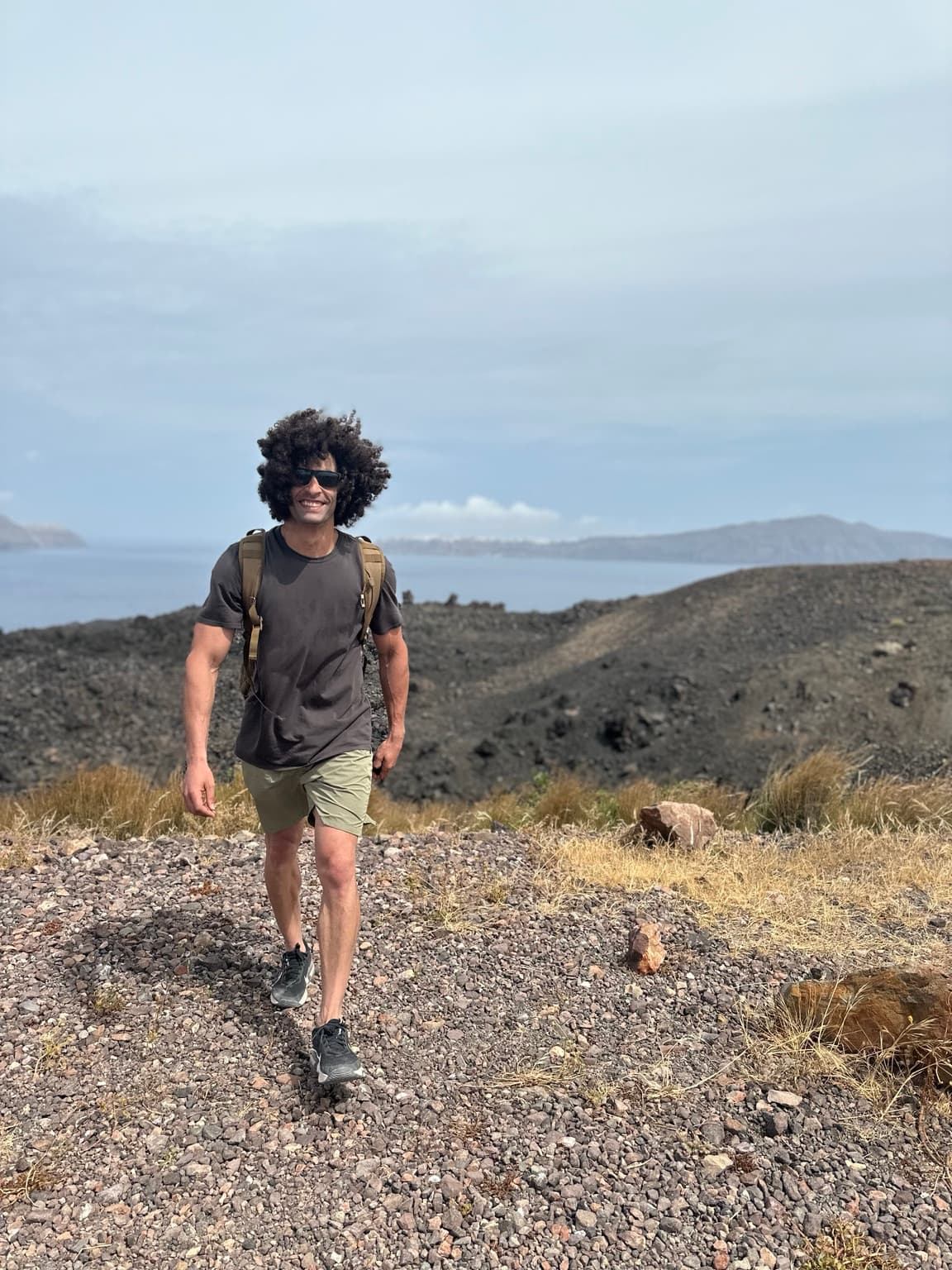 Ozzy walking across volcanic terrain
